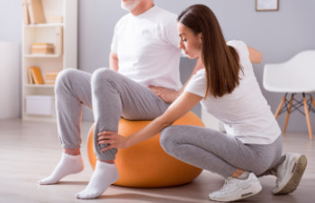 man during exercising with a physiotherapist